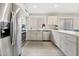 Modern kitchen with stainless steel appliances and white cabinets at 7365 E Adele Ct, Scottsdale, AZ 85255