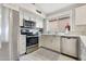 Updated kitchen featuring stainless steel appliances and an island at 7365 E Adele Ct, Scottsdale, AZ 85255