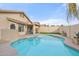 Inviting backyard pool with a freeform design and concrete decking at 7365 E Adele Ct, Scottsdale, AZ 85255