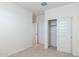 Bright bedroom with plush carpeting and spacious closet at 7419 W Whitehorn Trl, Peoria, AZ 85383