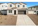 Two-story house with a large driveway and landscaped front yard at 7419 W Whitehorn Trl, Peoria, AZ 85383