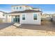 Rear view of a two-story house with a patio and large backyard at 7419 W Whitehorn Trl, Peoria, AZ 85383