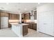 Modern kitchen with wood cabinets and quartz island at 7419 W Whitehorn Trl, Peoria, AZ 85383