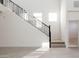 Modern staircase with metal railing in a bright hallway at 7419 W Whitehorn Trl, Peoria, AZ 85383