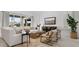 Relaxing living room featuring a sectional sofa, wooden coffee table, and a large TV at 7439 W Whitehorn Trl, Peoria, AZ 85383