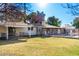 Spacious backyard with grassy lawn and access to the pool and patio at 7622 N 7Th Ave, Phoenix, AZ 85021