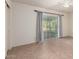 Bright bedroom with tile floors and sliding glass door to patio at 7622 N 7Th Ave, Phoenix, AZ 85021