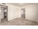 Bedroom with tile floors, double doors to closet and bathroom at 7622 N 7Th Ave, Phoenix, AZ 85021