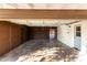 Garage with double doors, storage, and access to backyard at 7622 N 7Th Ave, Phoenix, AZ 85021