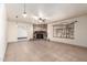 Living room featuring a stone fireplace and large window at 7622 N 7Th Ave, Phoenix, AZ 85021