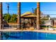 Inviting backyard oasis with a sparkling pool, gazebo, and lush landscaping at 7622 N 7Th Ave, Phoenix, AZ 85021