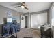 Bedroom featuring a large closet, carpeted floor, and a ceiling fan at 7743 E Roosevelt St, Scottsdale, AZ 85257