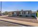 Charming single-story home with a covered carport, neat landscaping, and a welcoming front entrance at 7743 E Roosevelt St, Scottsdale, AZ 85257