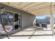 Covered patio with an egg chair, seating area and view of the pool at 7743 E Roosevelt St, Scottsdale, AZ 85257