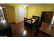 Bedroom with hardwood floor, bookcase, and desk at 7828 N 47Th Ave, Glendale, AZ 85301