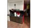 Kitchen with red cabinets and dark countertop at 7828 N 47Th Ave, Glendale, AZ 85301