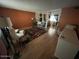 Living room with wood floors, seating area and adjacent dining space at 7828 N 47Th Ave, Glendale, AZ 85301