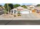 Single-story home with driveway and desert landscaping at 7908 W Rose Garden Ln, Peoria, AZ 85382