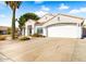 White stucco house with a two-car garage and a nicely landscaped yard at 7908 W Rose Garden Ln, Peoria, AZ 85382