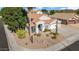 Single-story home with desert landscaping and two-car garage at 7908 W Rose Garden Ln, Peoria, AZ 85382