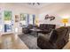 Bright living room featuring comfortable seating and a large window at 7908 W Rose Garden Ln, Peoria, AZ 85382