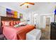 Relaxing main bedroom with coral bedding and a walk-in closet at 7908 W Rose Garden Ln, Peoria, AZ 85382