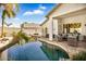 Stunning pool with rock features and patio furniture at 7908 W Rose Garden Ln, Peoria, AZ 85382