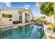 Inviting backyard pool with patio and seating area at 7908 W Rose Garden Ln, Peoria, AZ 85382