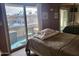 Bedroom with sliding glass door leading to a balcony at 8210 E Garfield St # K213, Scottsdale, AZ 85257