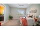 Cozy bedroom with queen bed, window with shutters, and warm color palette at 8519 E Regina Cir, Mesa, AZ 85207