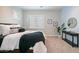 Spacious bedroom with a comfortable bed, window with shutters, and stylish decor at 8519 E Regina Cir, Mesa, AZ 85207