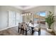 Bright dining room with sliding doors leading to a scenic view at 8519 E Regina Cir, Mesa, AZ 85207