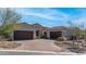 Beautiful home exterior with a three car garage at 8519 E Regina Cir, Mesa, AZ 85207