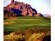 Scenic golf course view with mountain backdrop at 8519 E Regina Cir, Mesa, AZ 85207