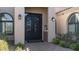 Elegant entryway with double iron doors and brick walkway at 8519 E Regina Cir, Mesa, AZ 85207