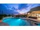 Night view of a beautiful pool and spa with mountain views at 8519 E Regina Cir, Mesa, AZ 85207