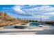 Inviting pool and spa with a water feature; creating a tranquil oasis at 8519 E Regina Cir, Mesa, AZ 85207