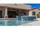 Resort-style pool and spa with water feature at 8519 E Regina Cir, Mesa, AZ 85207