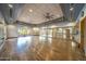 Bright yoga studio with hardwood floors and mirrors at 8519 E Regina Cir, Mesa, AZ 85207