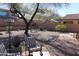 Landscaped backyard featuring a patio area with seating at 9219 S 185Th Ave, Goodyear, AZ 85338