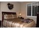 Bright bedroom with a queen-size bed and window at 9219 S 185Th Ave, Goodyear, AZ 85338