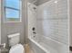 Clean bathroom featuring a bathtub and modern tile at 10211 E Wavelength Ave, Mesa, AZ 85212