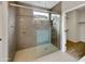 Large walk-in shower with gray tile and glass enclosure at 10211 E Wavelength Ave, Mesa, AZ 85212