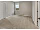 Spacious bedroom with neutral walls and plush carpeting at 10211 E Wavelength Ave, Mesa, AZ 85212