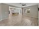 Open concept living room with tile flooring and a view of the kitchen at 10211 E Wavelength Ave, Mesa, AZ 85212