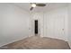 Bedroom with ceiling fan, double door closet and access to bathroom at 10960 E Monte Ave # 223, Mesa, AZ 85209