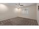 Bright bedroom with neutral walls, ceiling fan, and plush carpeting at 10960 E Monte Ave # 223, Mesa, AZ 85209