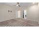 Bedroom with ceiling fan, neutral walls, and carpet flooring at 10960 E Monte Ave # 223, Mesa, AZ 85209