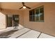 Covered patio with ceiling fan and sliding glass door at 10960 E Monte Ave # 223, Mesa, AZ 85209