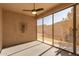 Bright screened patio with ceiling fan and view of backyard at 10960 E Monte Ave # 223, Mesa, AZ 85209